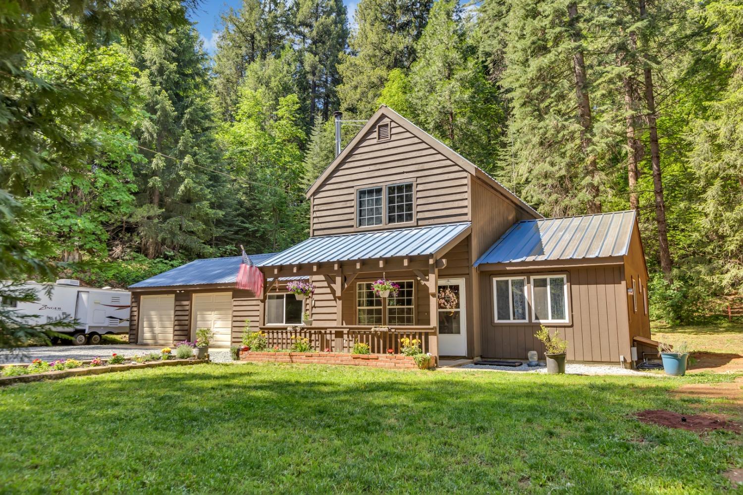 34680 Alta Bonnynook Road Alta, CA 95701 - Photo 1 of 1 a front view of a house with a garden and porch