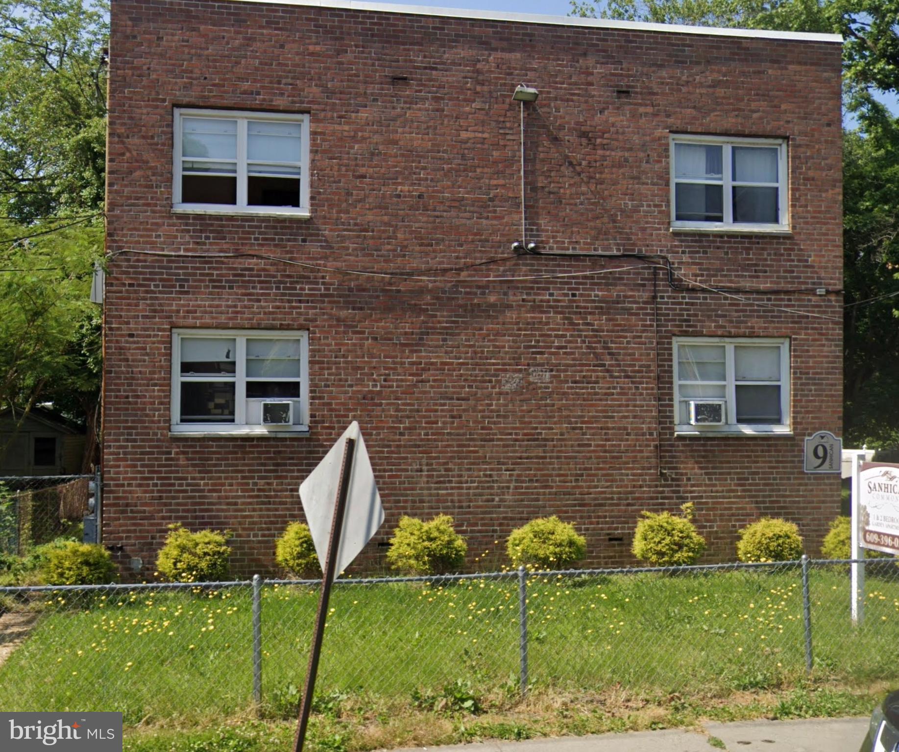 9-11 Sanhican Drive, Unit A2 Trenton, NJ 08618 - Photo 1 of 1 a front view of a house with a yard