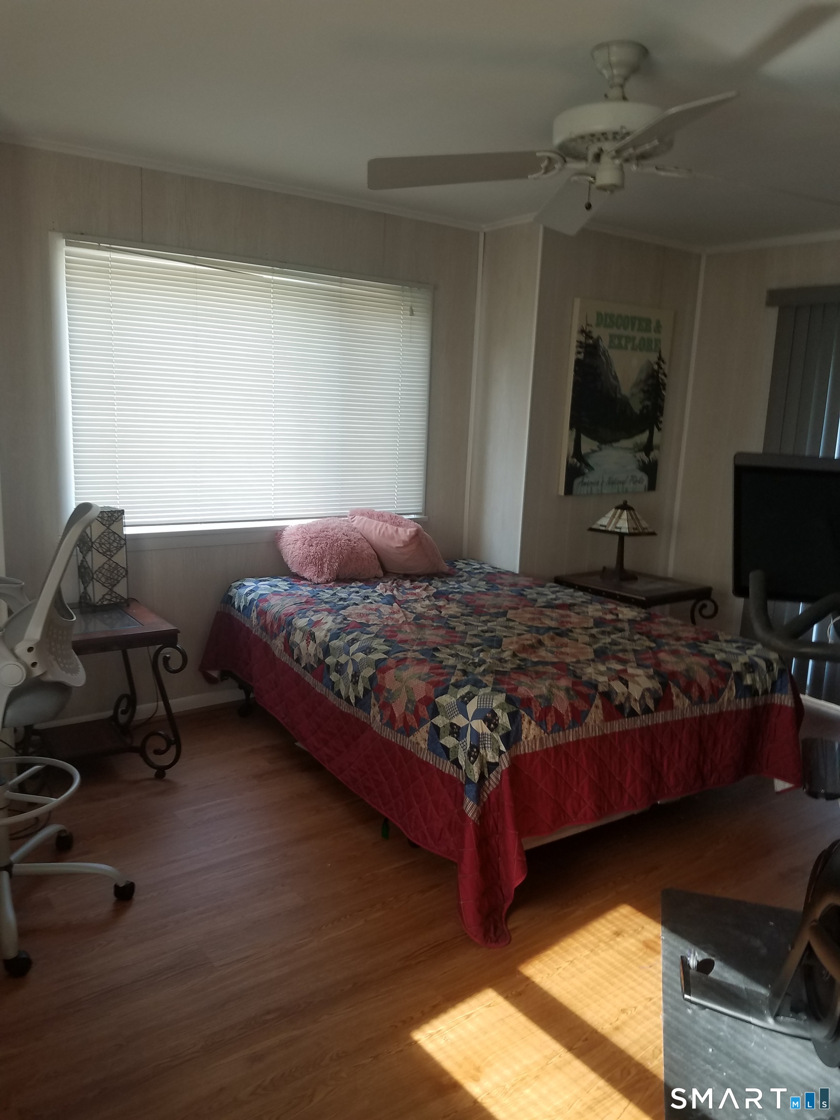 72 Maple Tree Avenue, Unit 2 Stamford, CT 06906 - Photo 12 of 25 a bedroom with a bed and a flat screen tv