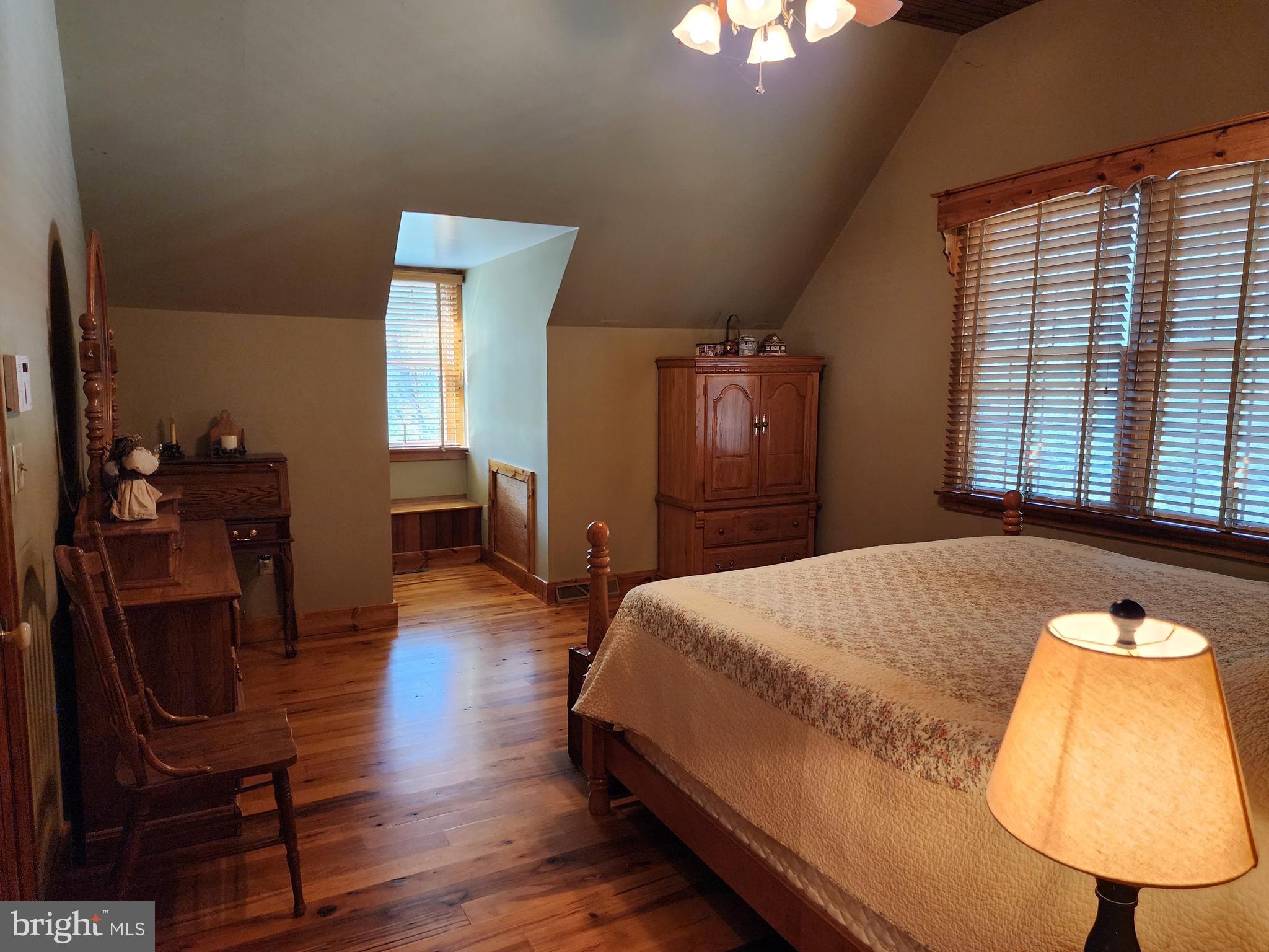 14847 White Oak Ridge Hancock, MD 21750 - Photo 18 of 101 a bedroom with a bed a dresser and chair
