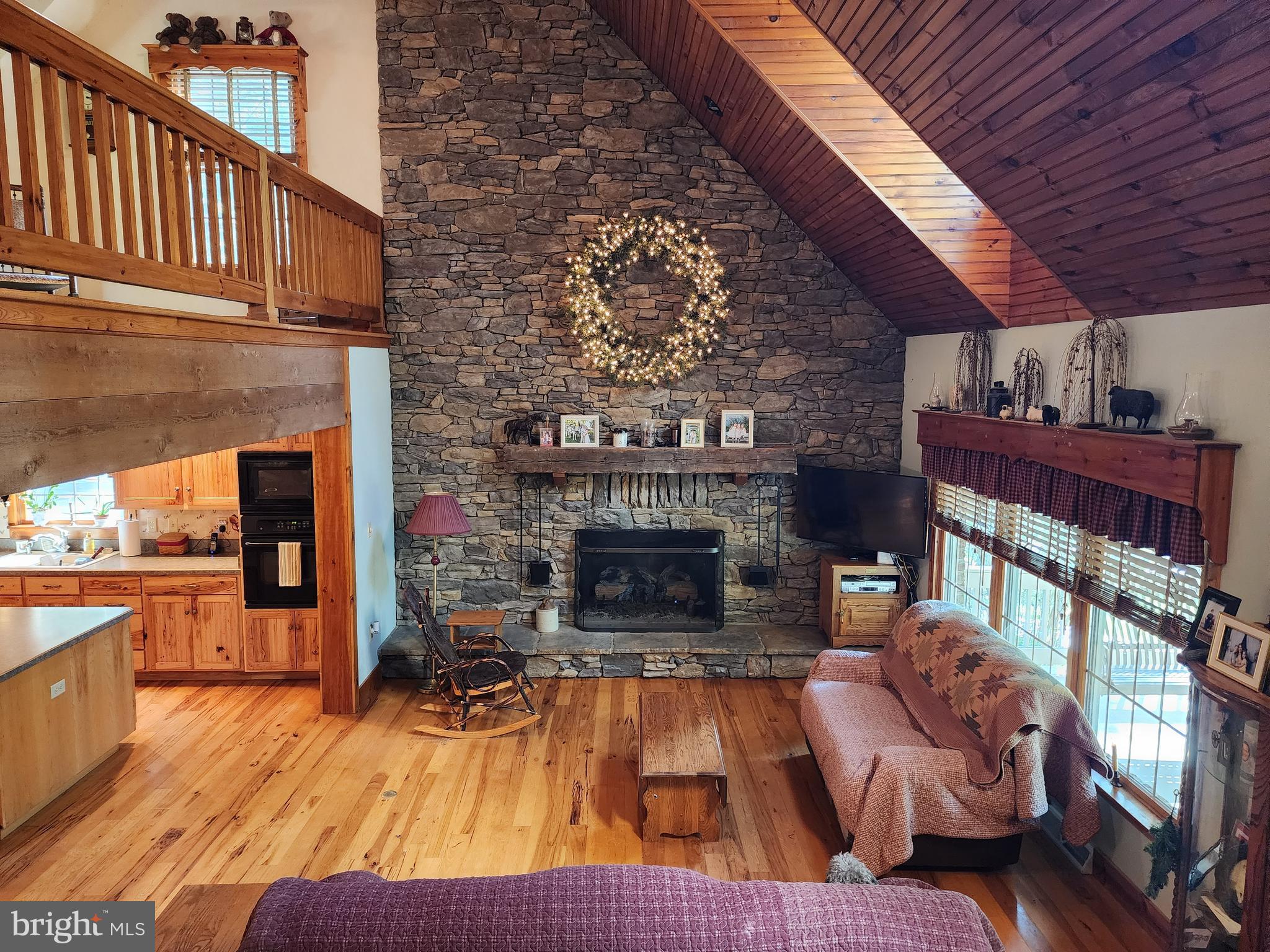 14847 White Oak Ridge Hancock, MD 21750 - Photo 21 of 101 a living room with furniture and a fireplace