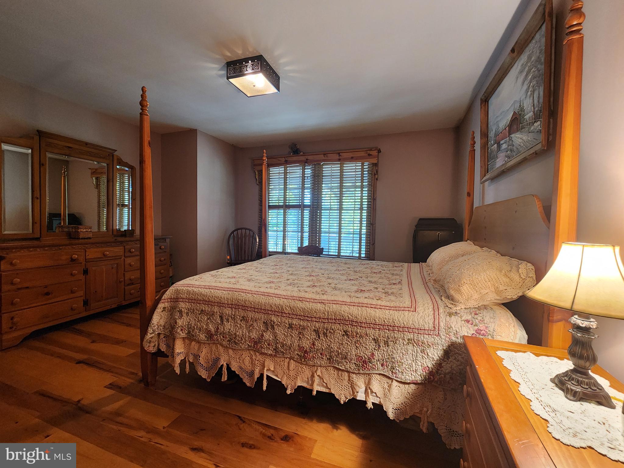 14847 White Oak Ridge Hancock, MD 21750 - Photo 32 of 101 a bedroom with a bed and wooden floor