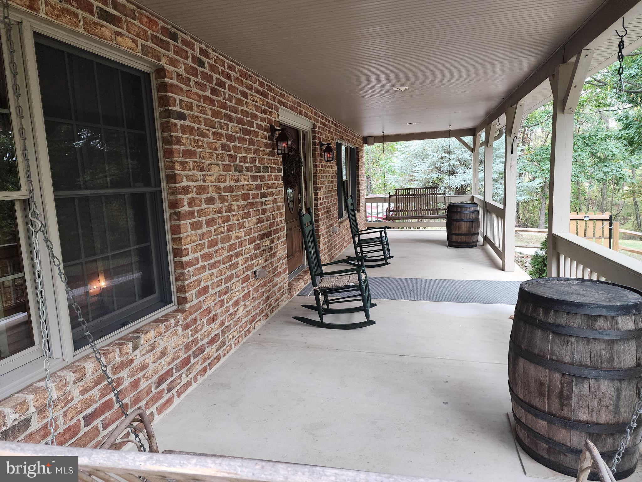 14847 White Oak Ridge Hancock, MD 21750 - Photo 63 of 101 a living room with furniture and a floor to ceiling window