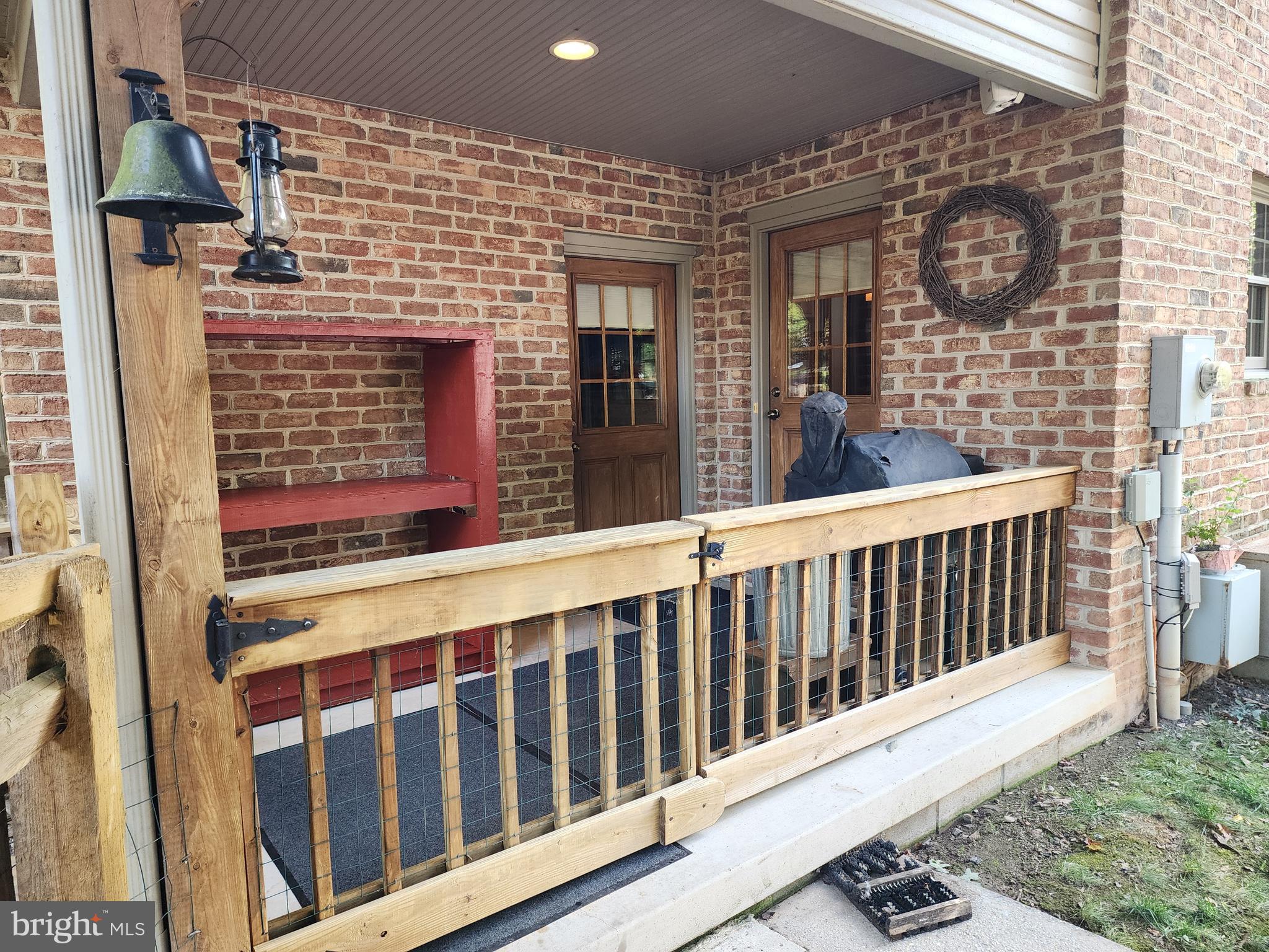 14847 White Oak Ridge Hancock, MD 21750 - Photo 71 of 101 a porch with a bench next to a yard