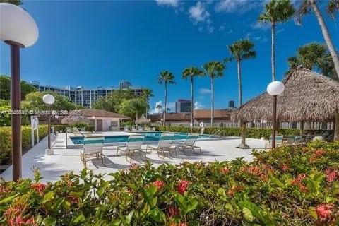 Three Islands Hallandale Beach, FL 33009 - Photo 1 of 10 a view of a yard with plants and a fountain