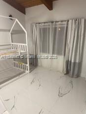 Three Islands Hallandale Beach, FL 33009 - Photo 4 of 10 a view of an empty room with wooden floor and a cabinet