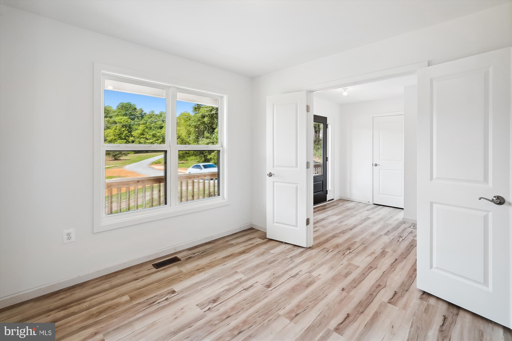 2 Cedar Ridge Road Rapidan, VA 22733 - Photo 26 of 59 a view of an empty room with wooden floor and a window