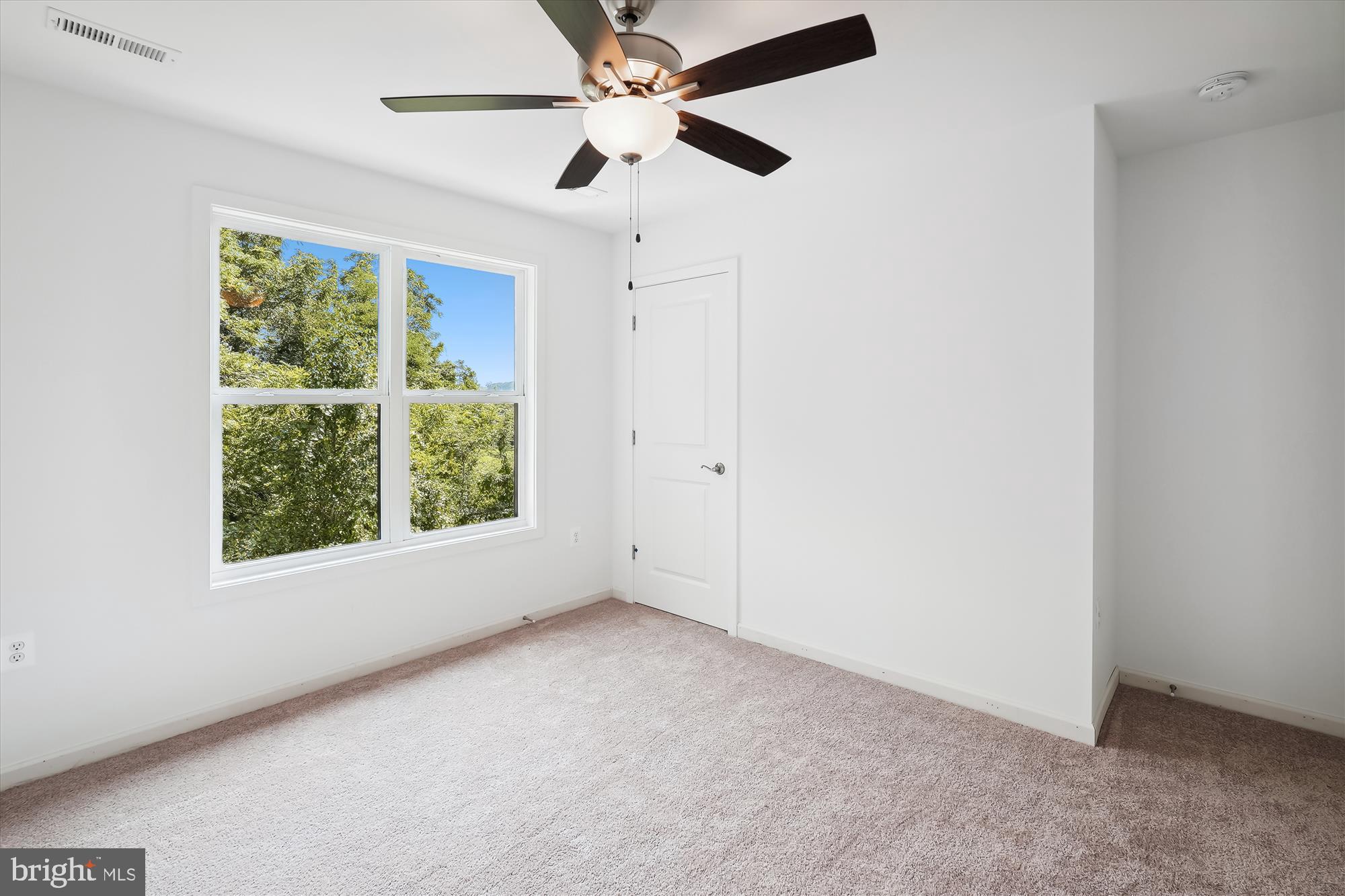 2 Cedar Ridge Road Rapidan, VA 22733 - Photo 43 of 59 an empty room with a window and a fan