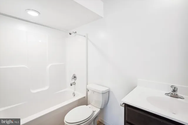a view of a porch with wooden floor and iron stairs