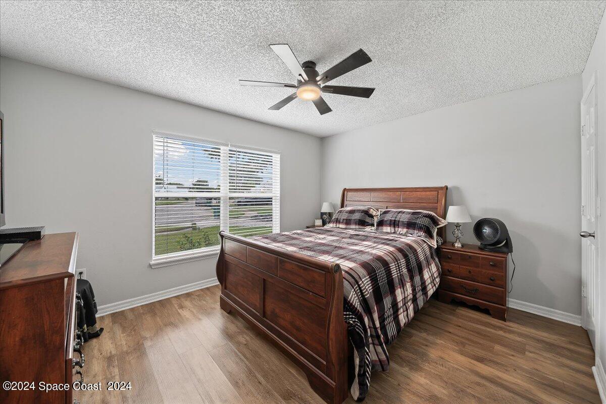 3905 Grand Meadows Boulevard Melbourne, FL 32934 - Photo 17 of 32 a bedroom with a bed and a window