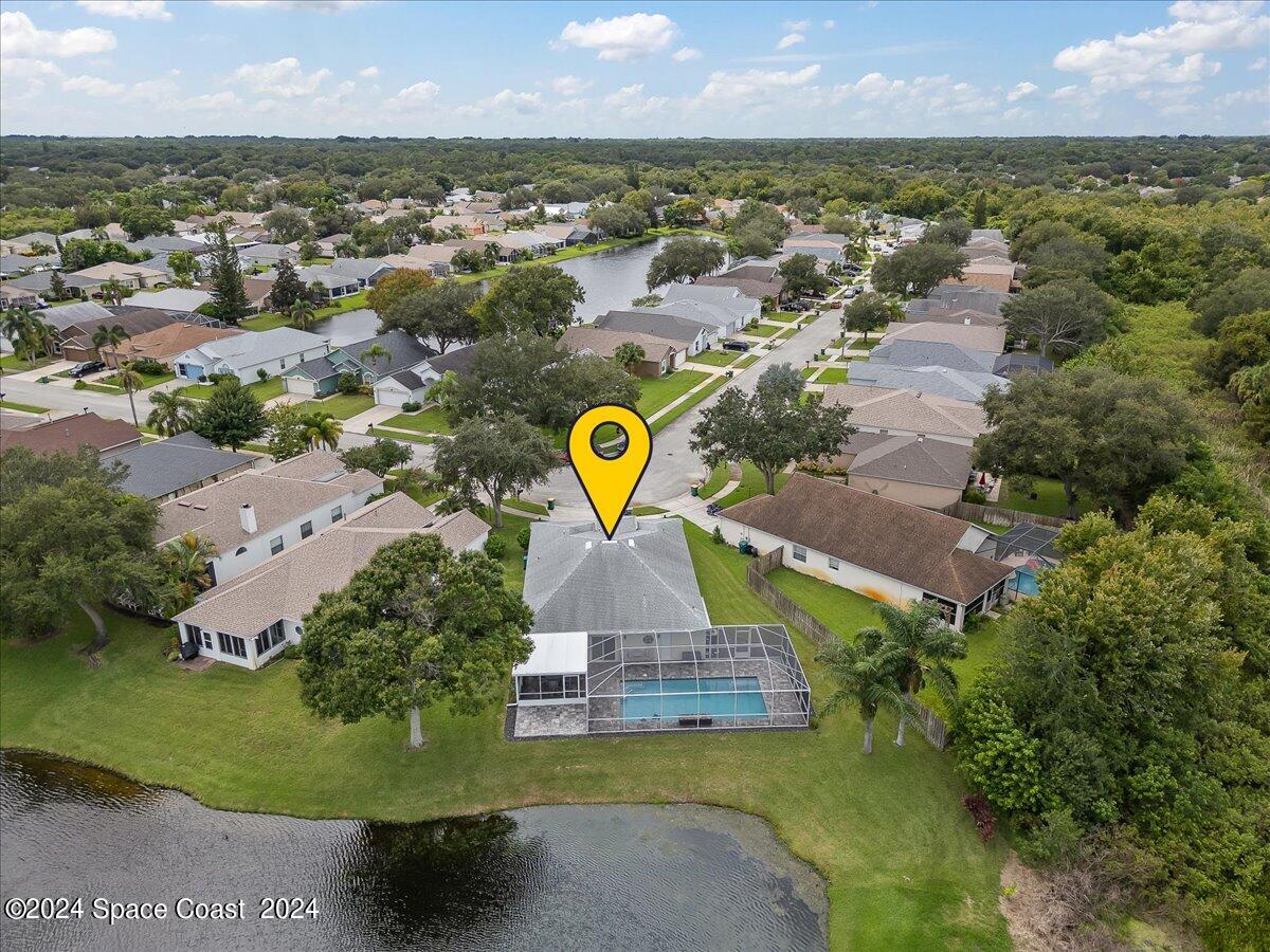 3905 Grand Meadows Boulevard Melbourne, FL 32934 - Photo 21 of 32 an aerial view of a house with a swimming pool