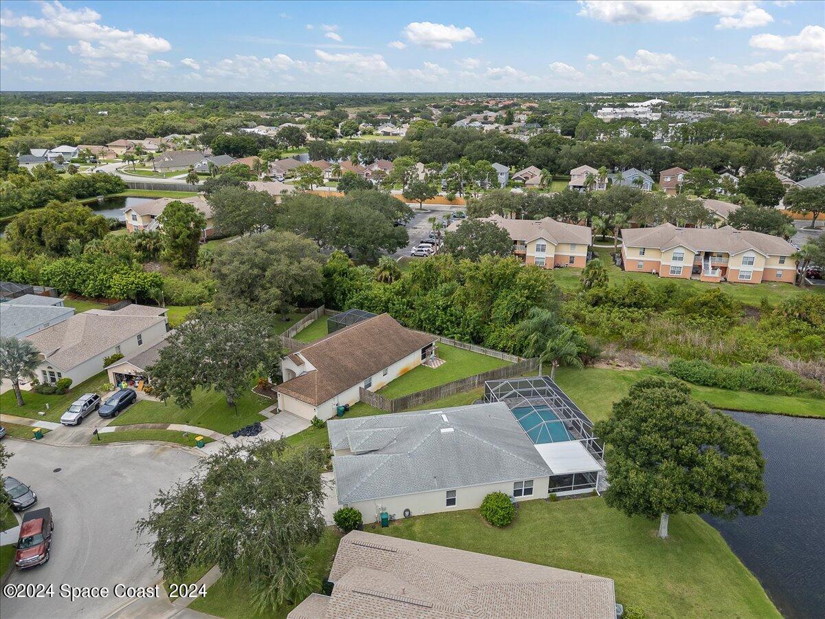 3905 Grand Meadows Boulevard Melbourne, FL 32934 - Photo 24 of 32 an aerial view of residential houses with outdoor space and river