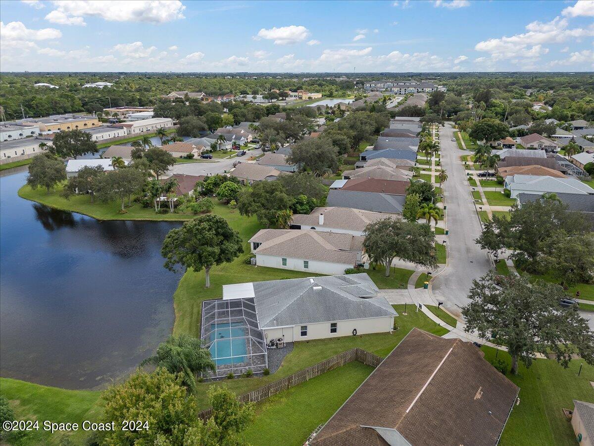 3905 Grand Meadows Boulevard Melbourne, FL 32934 - Photo 26 of 32 an aerial view of residential houses with outdoor space and river