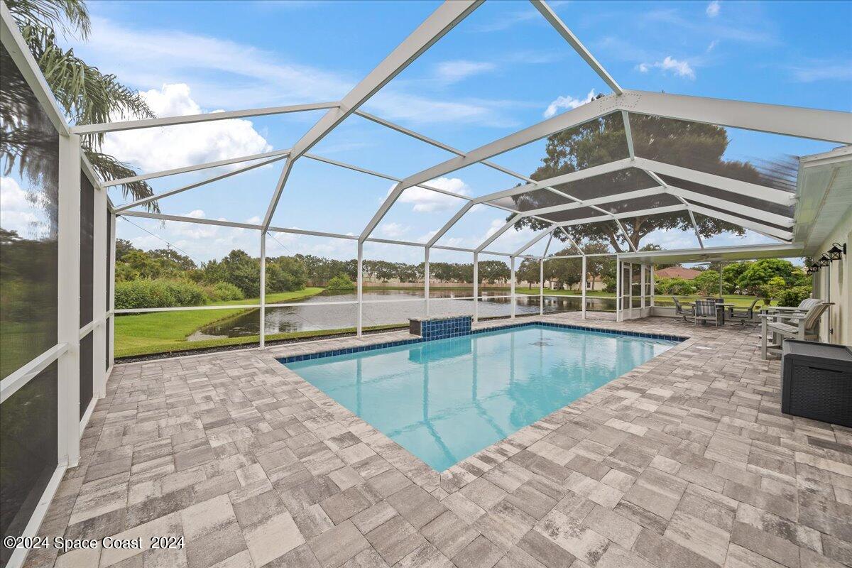 3905 Grand Meadows Boulevard Melbourne, FL 32934 - Photo 27 of 32 a view of a backyard with swimming pool