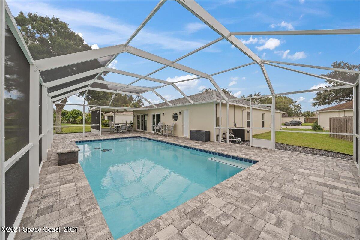 3905 Grand Meadows Boulevard Melbourne, FL 32934 - Photo 29 of 32 a view of a swimming pool with a patio