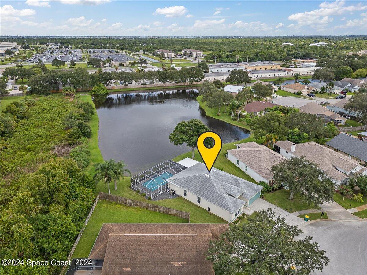 3905 Grand Meadows Boulevard Melbourne, FL 32934 - Photo 3 of 32 an aerial view of a house with outdoor space and lake view