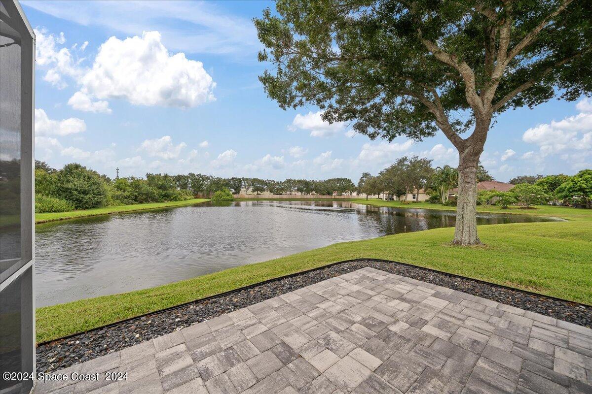3905 Grand Meadows Boulevard Melbourne, FL 32934 - Photo 32 of 32 a view of a lake with a big yard