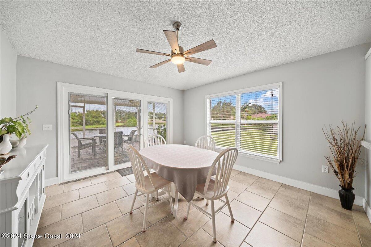 3905 Grand Meadows Boulevard Melbourne, FL 32934 - Photo 7 of 32 a dining room with furniture and window