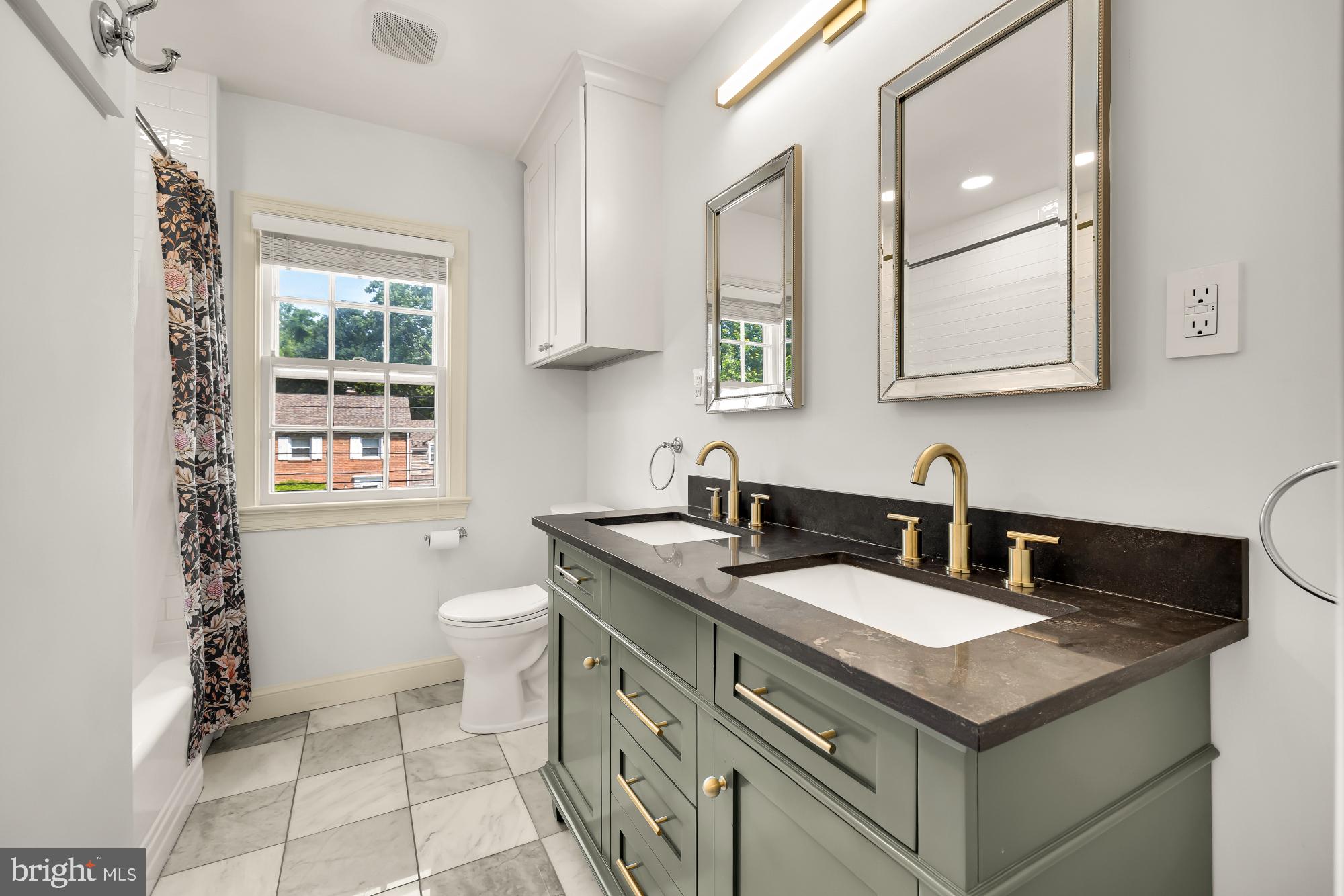 1802 August Drive Silver Spring, MD 20902 - Photo 13 of 26 a bathroom with a granite countertop sink a toilet and a mirror