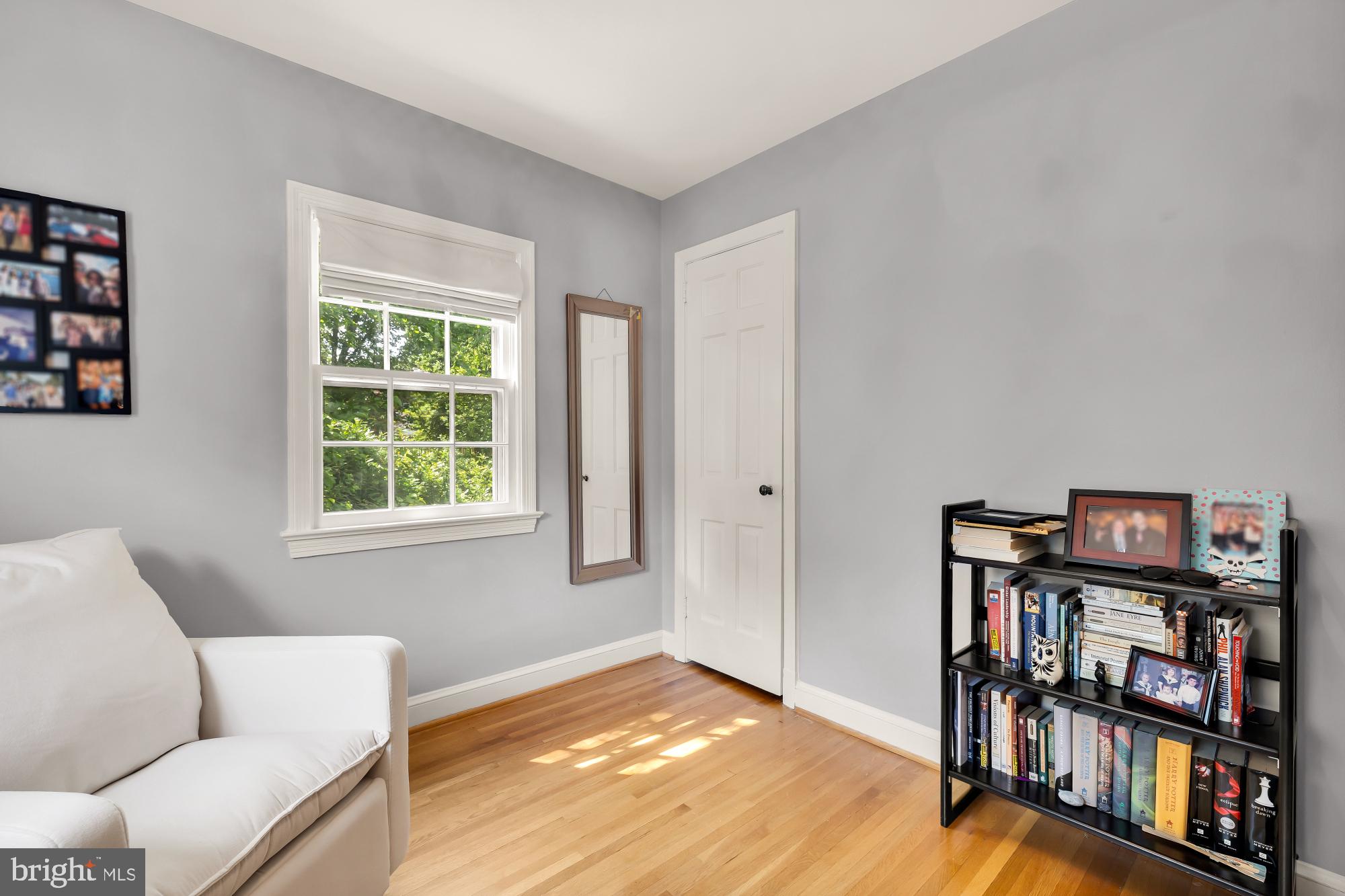 1802 August Drive Silver Spring, MD 20902 - Photo 14 of 26 a living room with furniture and a book shelf