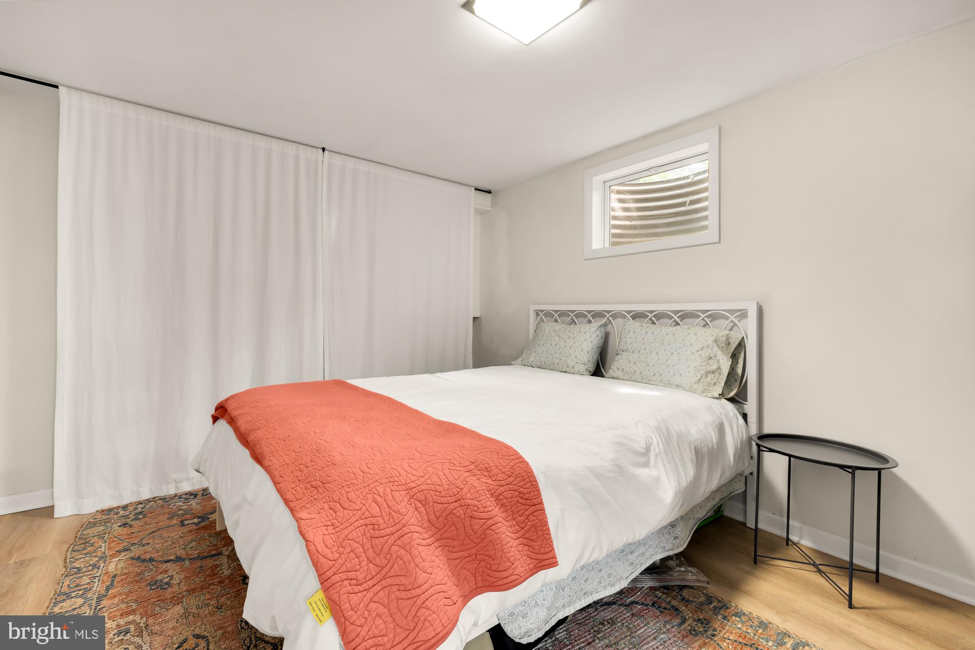 1802 August Drive Silver Spring, MD 20902 - Photo 20 of 26 a bedroom with a bed and a chair