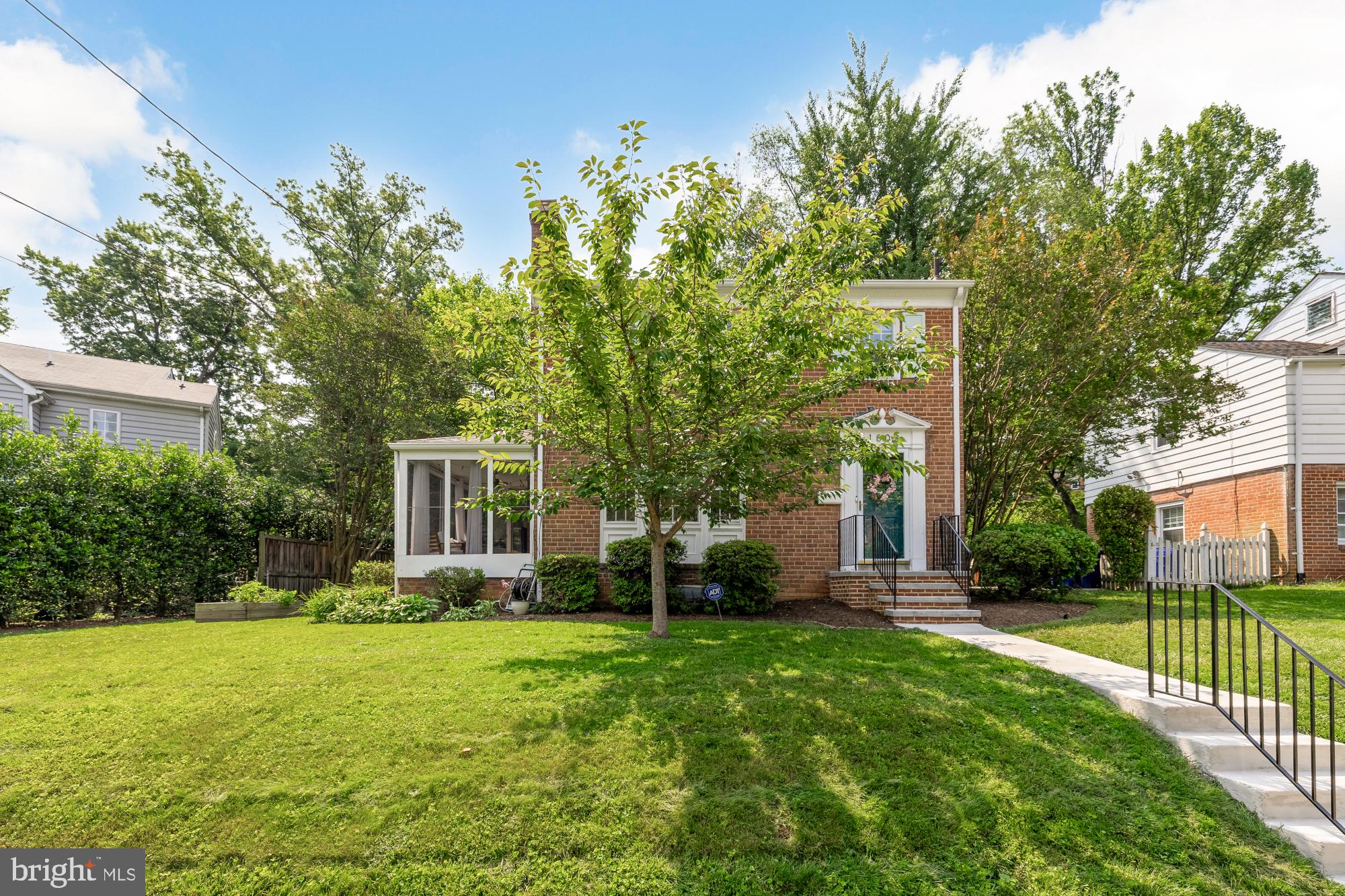1802 August Drive Silver Spring, MD 20902 - Photo 2 of 26 a front view of a house with garden