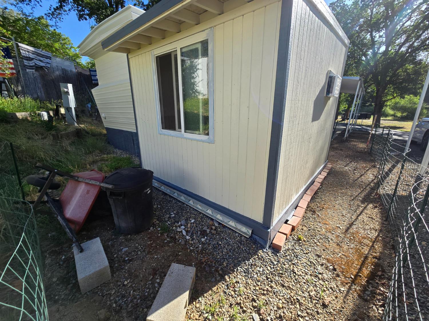 1525 Cold Springs Road, Unit 16 Placerville, CA 95667 - Photo 27 of 38 Small fenced in area for dog with doggie door on back door