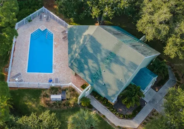 a view of a backyard with a lake view