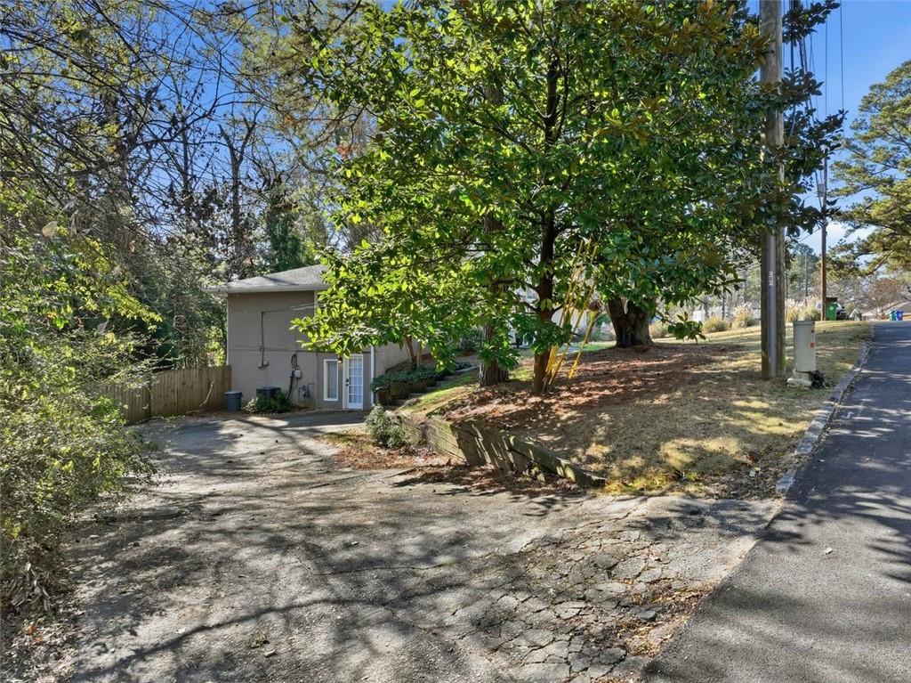 2002 Drew Valley Road Northeast Brookhaven, GA 30319 - Photo 27 of 51 a view of a house with large tree
