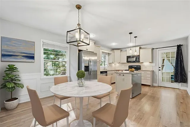 a kitchen with a table and chairs