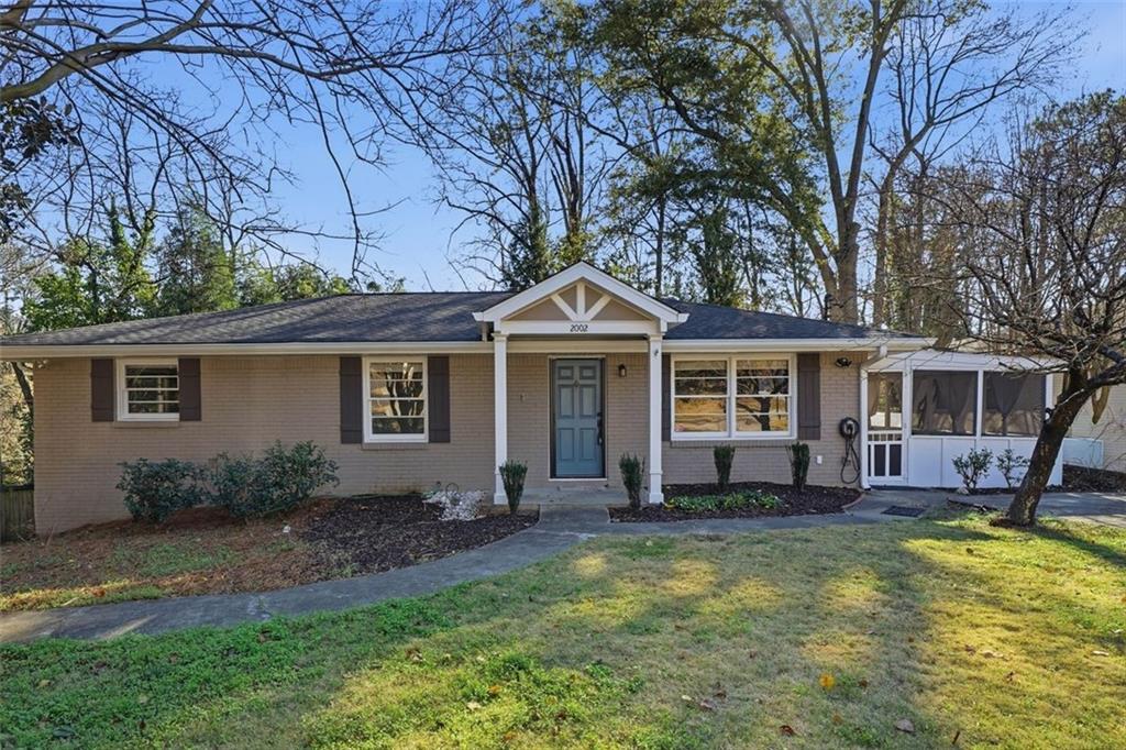 2002 Drew Valley Road Northeast Brookhaven, GA 30319 - Photo 44 of 51 a front view of house with yard and seating area