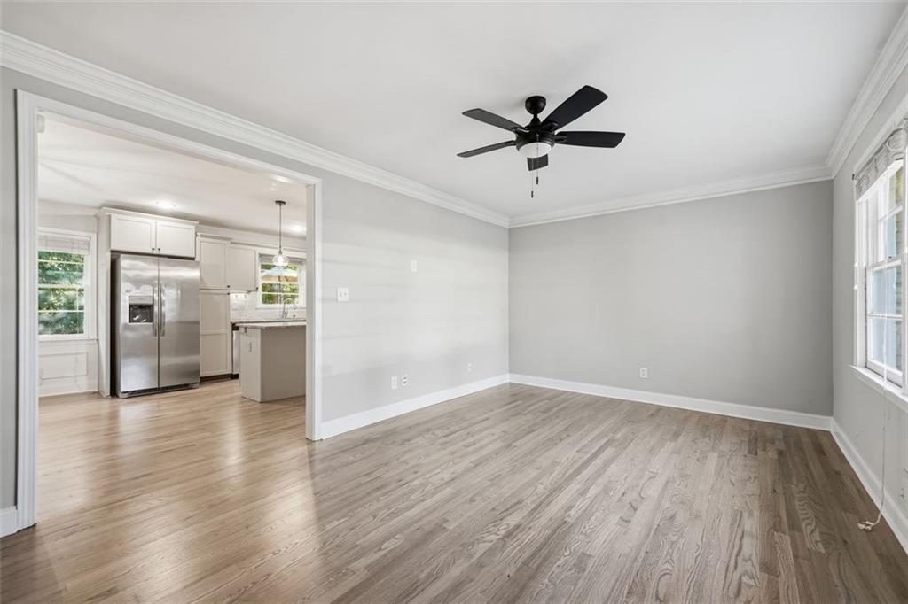 2002 Drew Valley Road Northeast Brookhaven, GA 30319 - Photo 7 of 51 a view of empty room with wooden floor and window