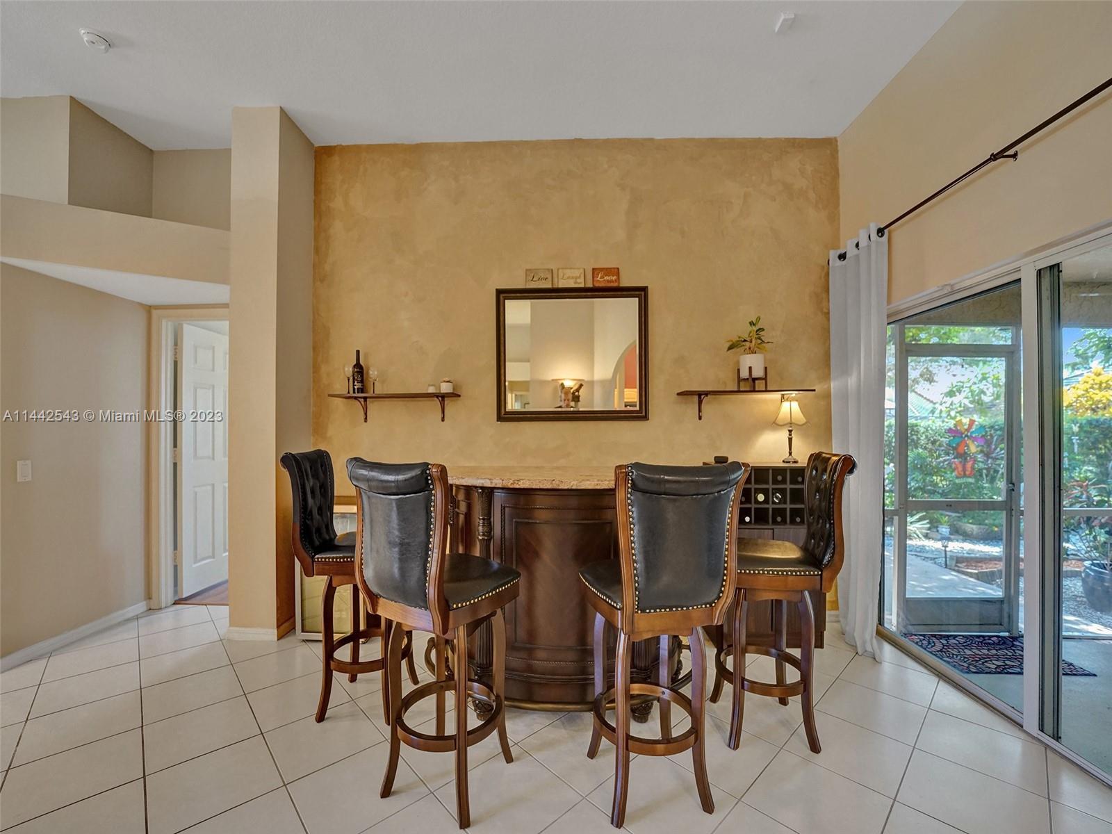 3273 Ridge Trace Davie, FL 33328 - Photo 14 of 74 a view of a dining room with furniture and window