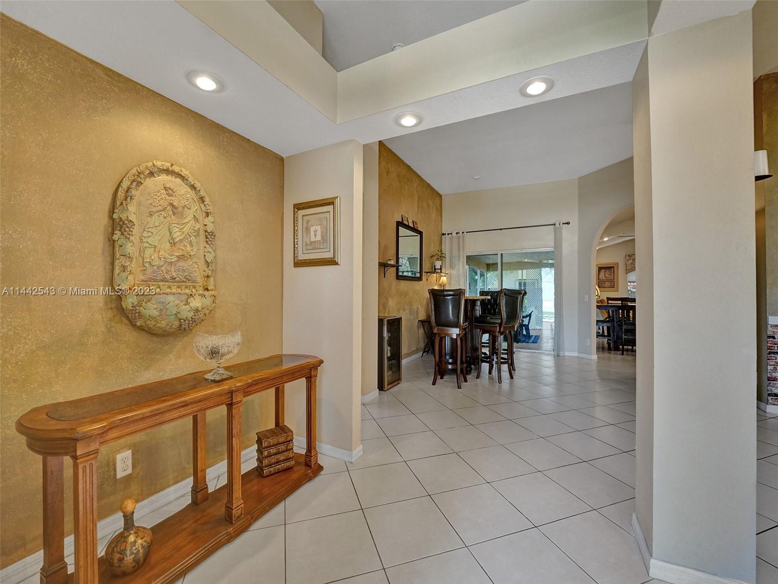 3273 Ridge Trace Davie, FL 33328 - Photo 17 of 74 a dining room with furniture and a table