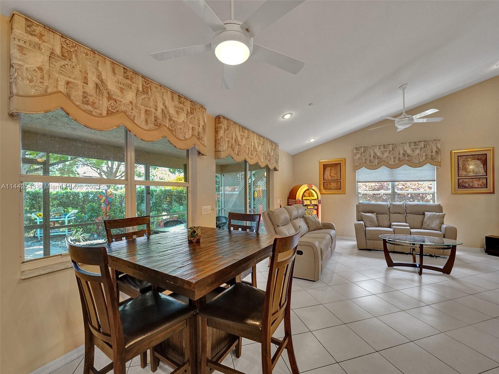 3273 Ridge Trace Davie, FL 33328 - Photo 19 of 74 a view of a dining room with furniture wooden floor and a chandelier