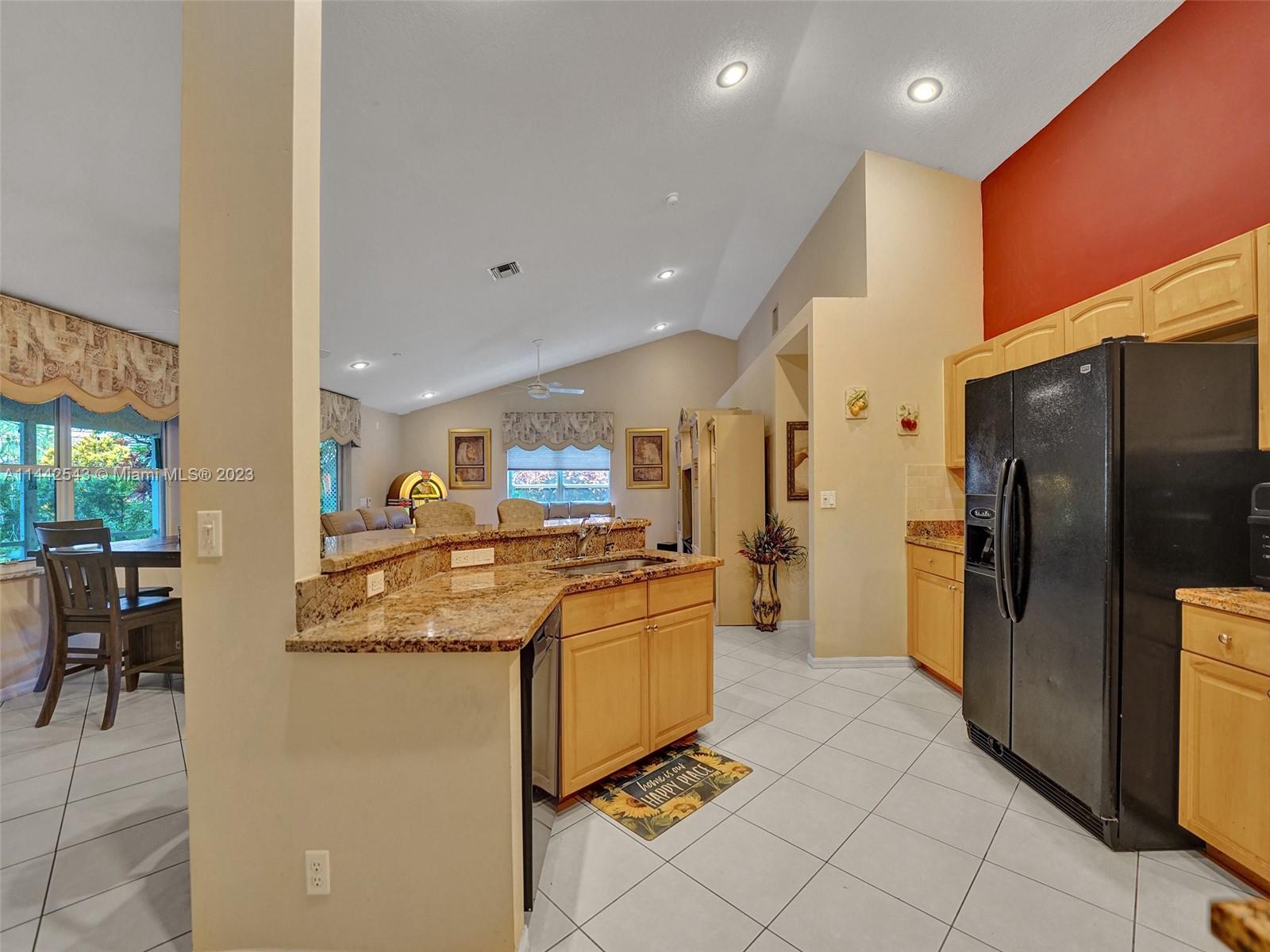 3273 Ridge Trace Davie, FL 33328 - Photo 23 of 74 a kitchen with stainless steel appliances granite countertop a refrigerator and a stove