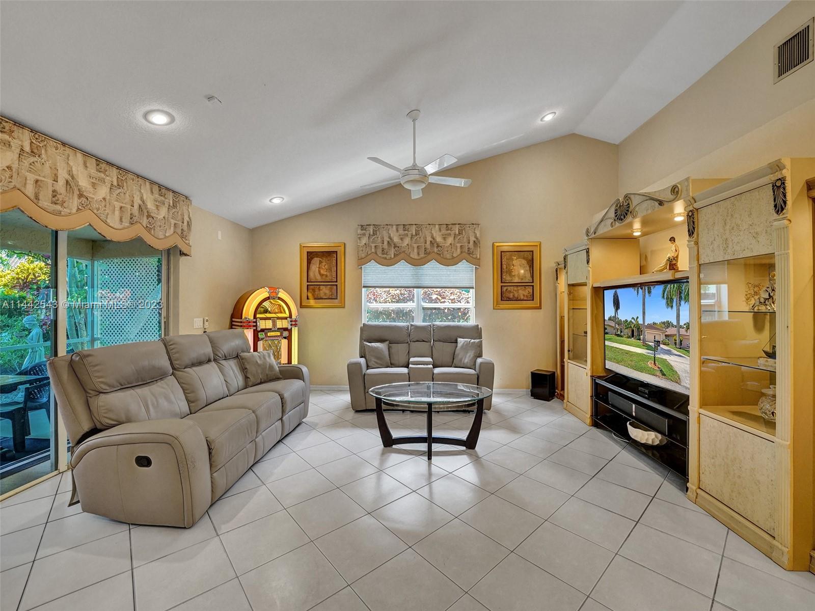 3273 Ridge Trace Davie, FL 33328 - Photo 29 of 74 a living room with furniture and a flat screen tv