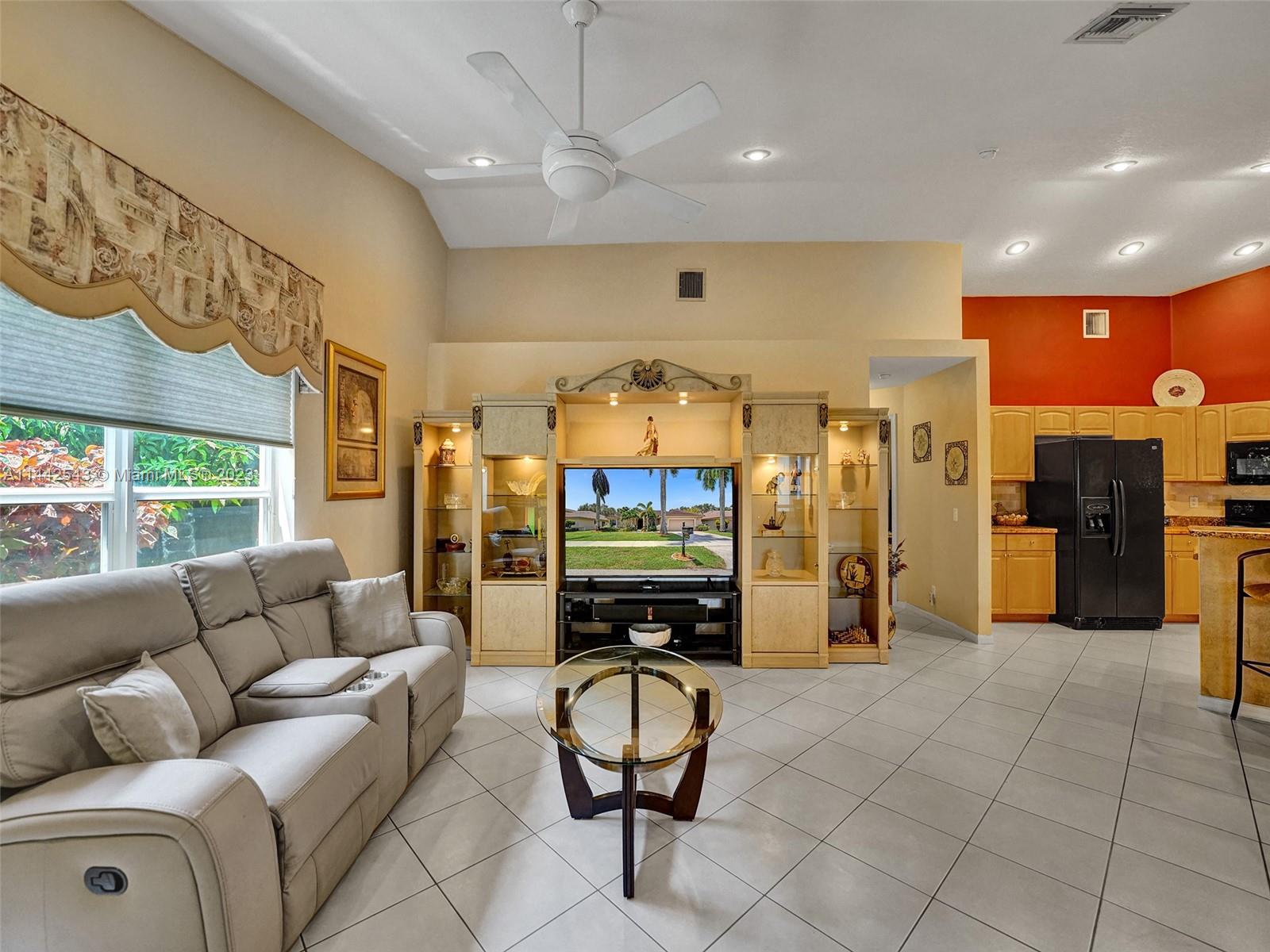 3273 Ridge Trace Davie, FL 33328 - Photo 31 of 74 a living room with furniture and a flat screen tv