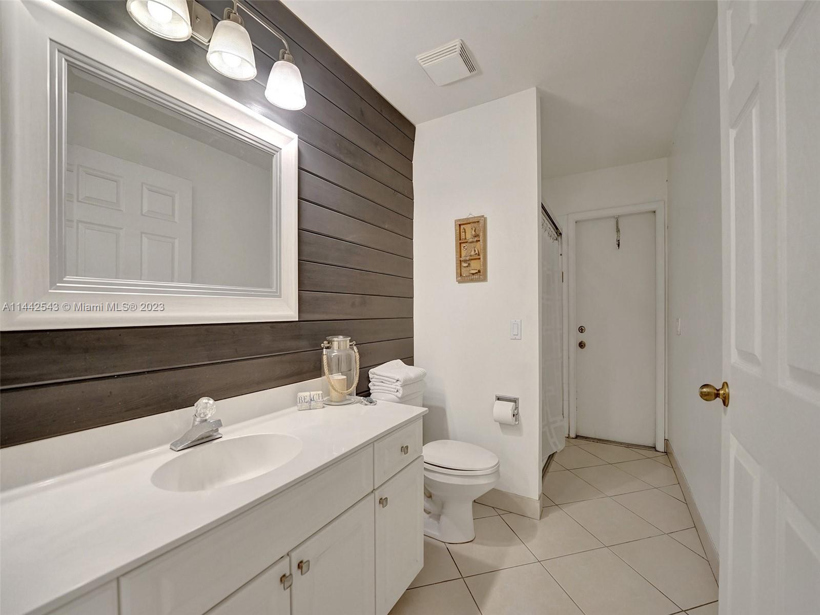 3273 Ridge Trace Davie, FL 33328 - Photo 47 of 74 a bathroom with a sink and a mirror