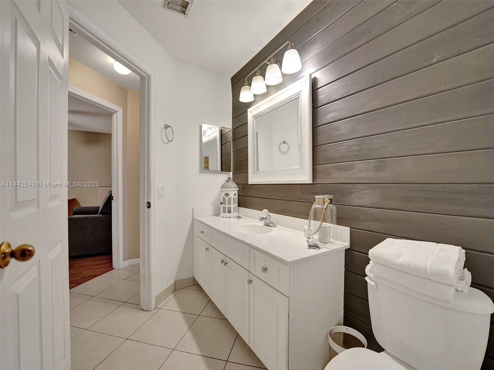 3273 Ridge Trace Davie, FL 33328 - Photo 48 of 74 a bathroom with a sink and a mirror