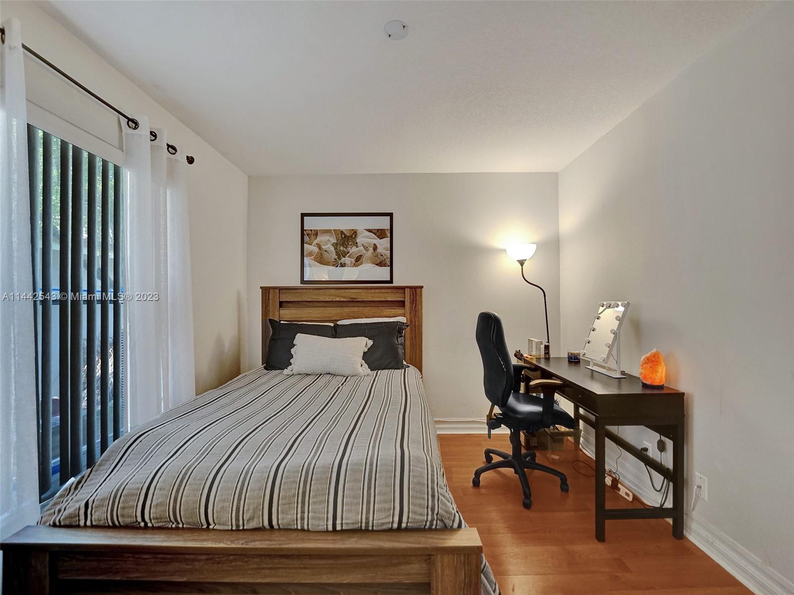 3273 Ridge Trace Davie, FL 33328 - Photo 50 of 74 a bedroom with a bed a desk and chair