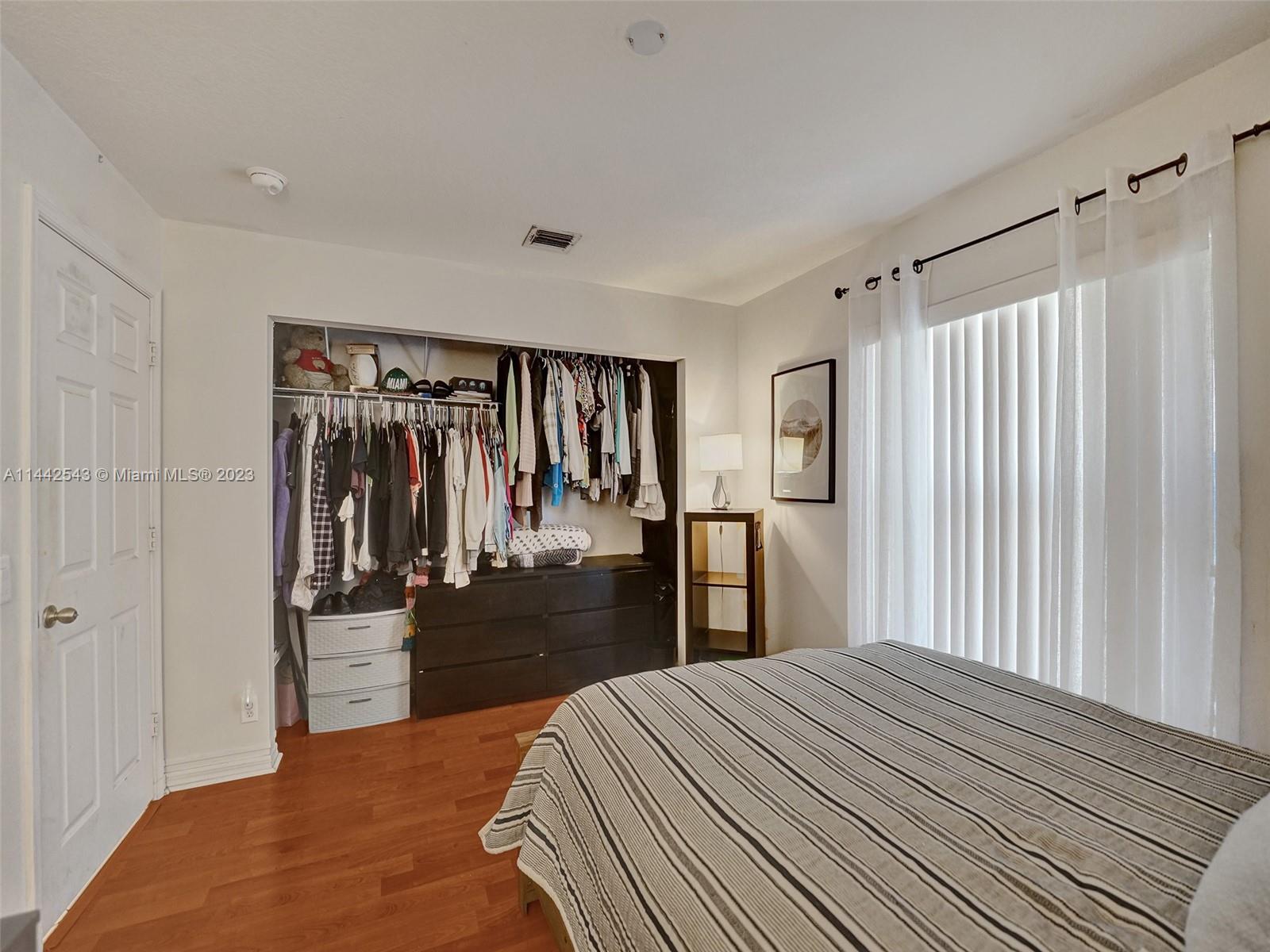 3273 Ridge Trace Davie, FL 33328 - Photo 51 of 74 a bedroom with a bed and a closet