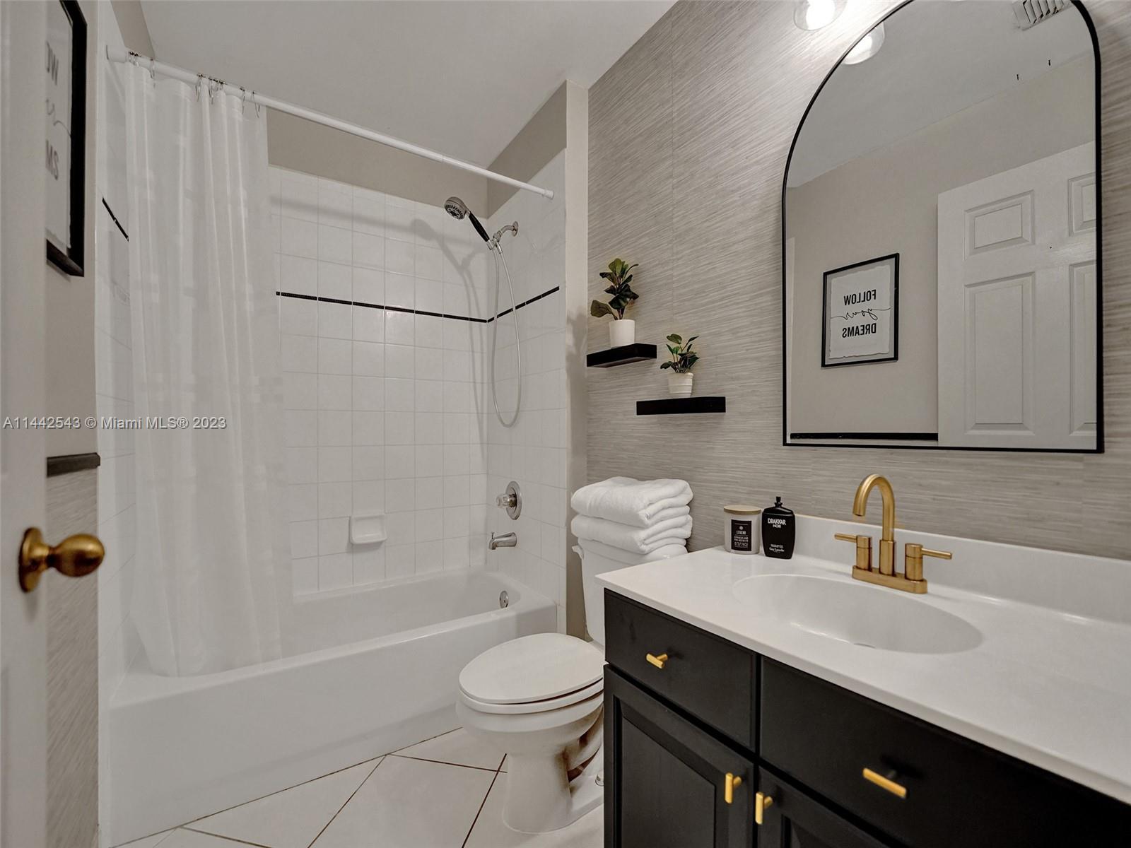 3273 Ridge Trace Davie, FL 33328 - Photo 52 of 74 a bathroom with a sink a toilet and shower