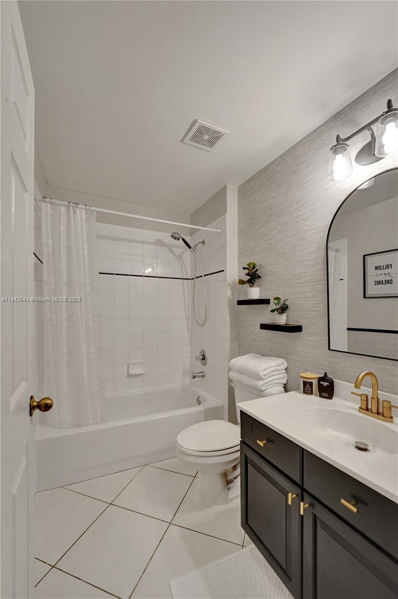 3273 Ridge Trace Davie, FL 33328 - Photo 54 of 74 a bathroom with a double vanity sink toilet and shower