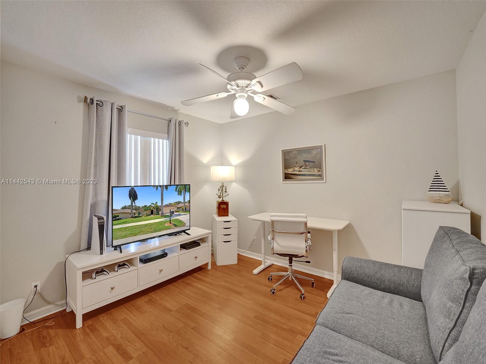 3273 Ridge Trace Davie, FL 33328 - Photo 55 of 74 a living room with furniture and a flat screen tv