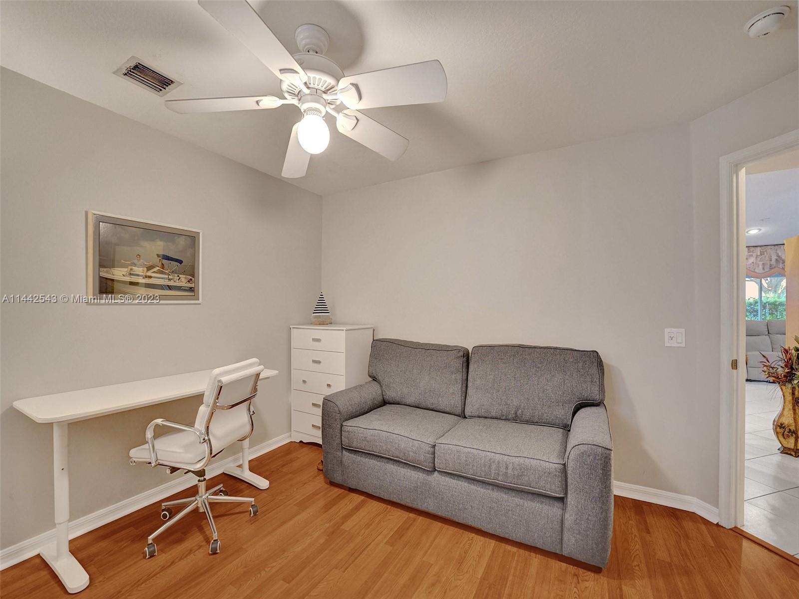 3273 Ridge Trace Davie, FL 33328 - Photo 56 of 74 a living room with furniture and a wooden floor