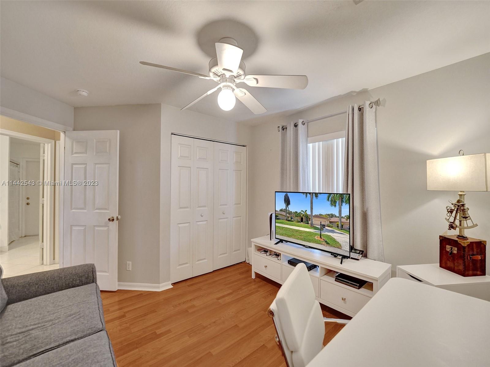3273 Ridge Trace Davie, FL 33328 - Photo 57 of 74 a bedroom with furniture and a flat screen tv