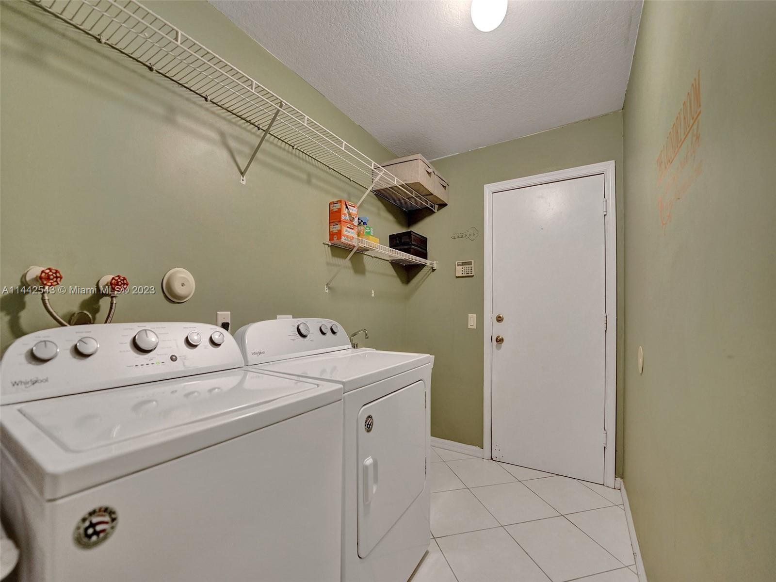 3273 Ridge Trace Davie, FL 33328 - Photo 58 of 74 a utility room with dryer and washer