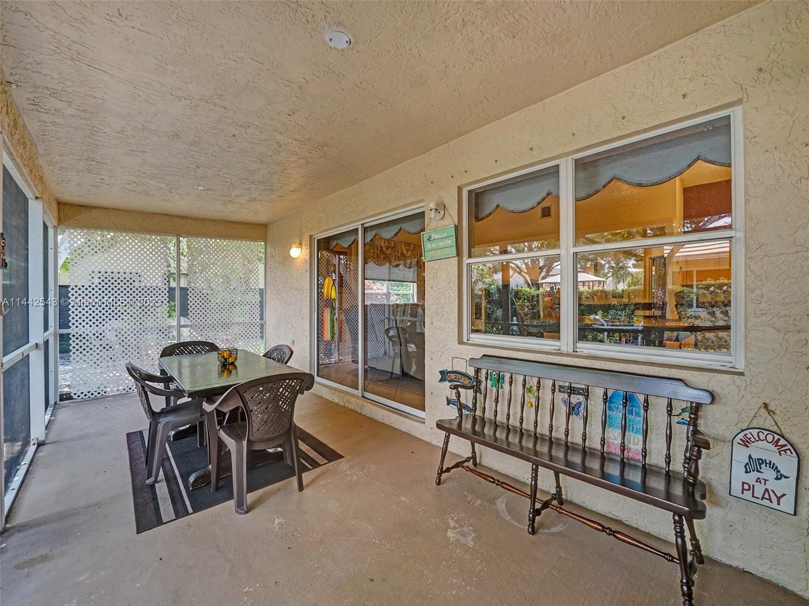 3273 Ridge Trace Davie, FL 33328 - Photo 61 of 74 a dining room with furniture water view and a floor to ceiling window