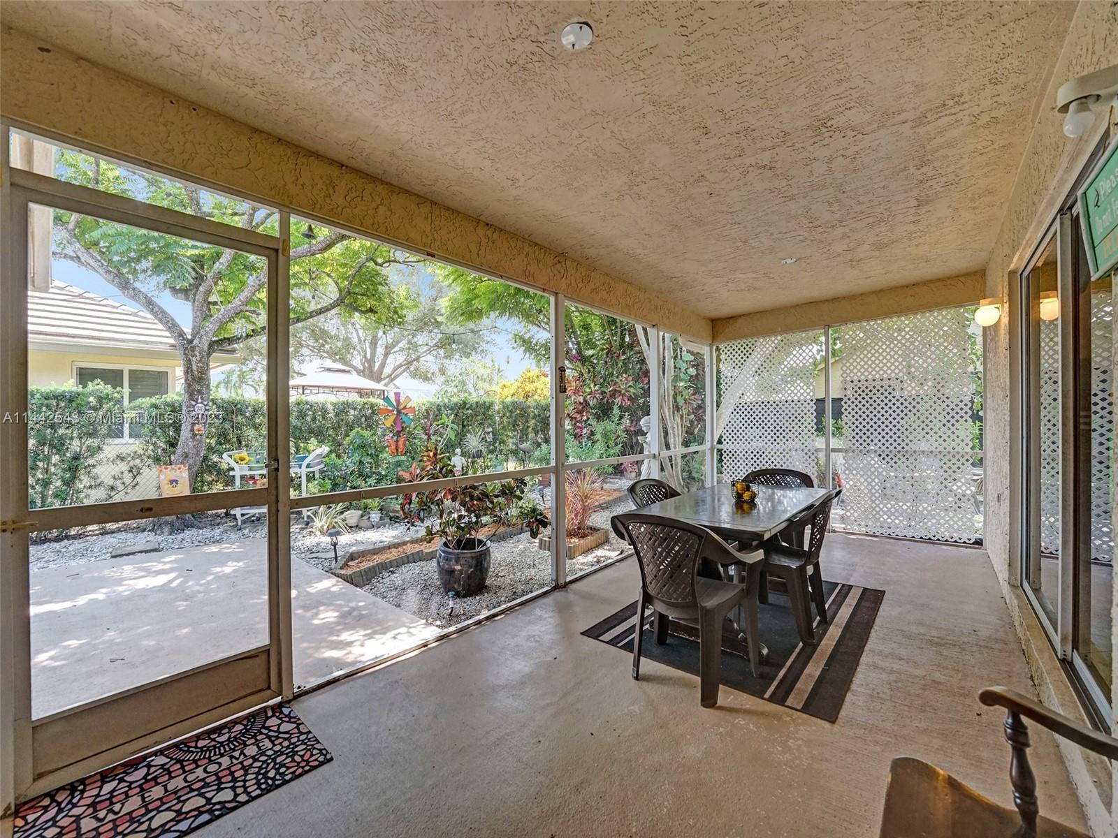 3273 Ridge Trace Davie, FL 33328 - Photo 63 of 74 a living room with furniture and a floor to ceiling window